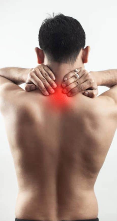 Man In Discomfort Holding His Neck Due To Pain