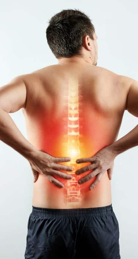 Man In Pain Clutching Lower Back